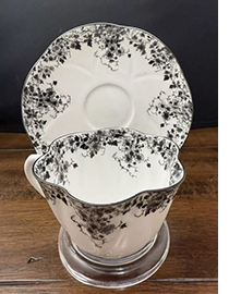 Dainty Black cup and saucer